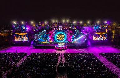 A picture containing lit, night, crowd Description automatically generated