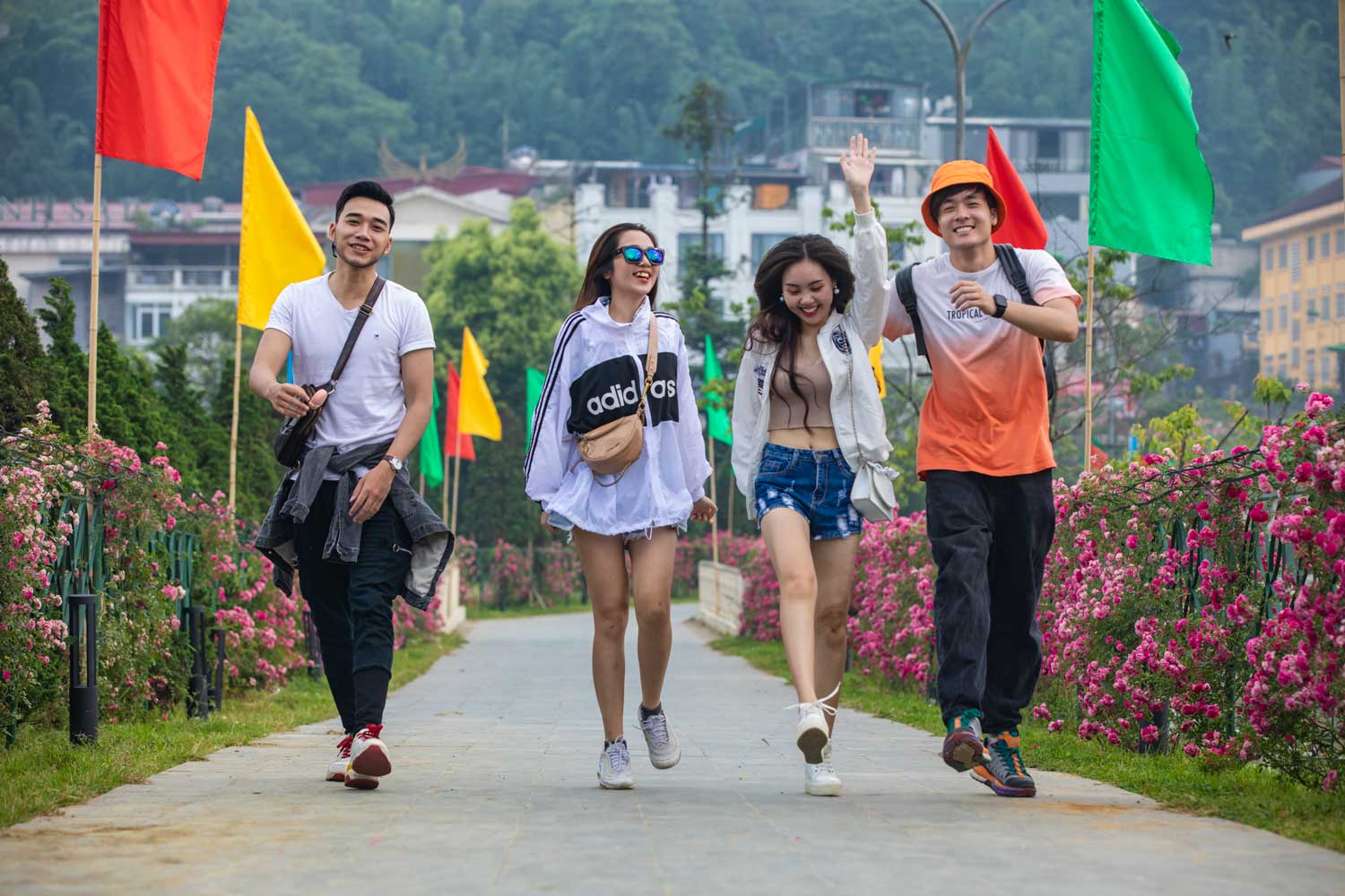 A group of people walking down the street Description automatically generated